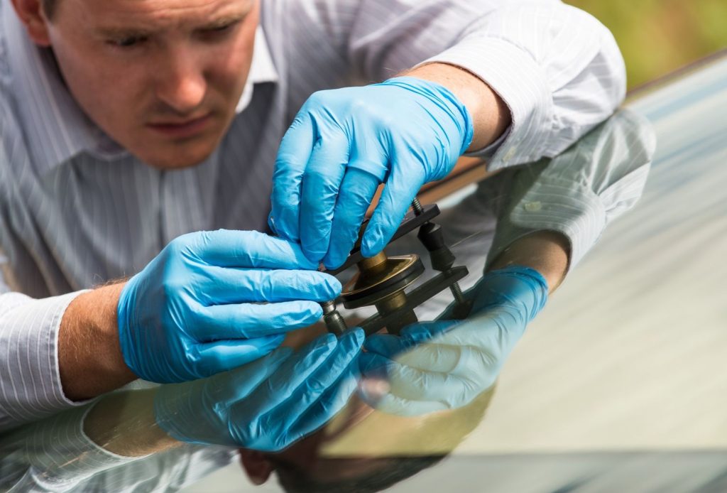 Close-up of rock chip repair on a car windshield, essential for a professional auto glass fix Baltimore