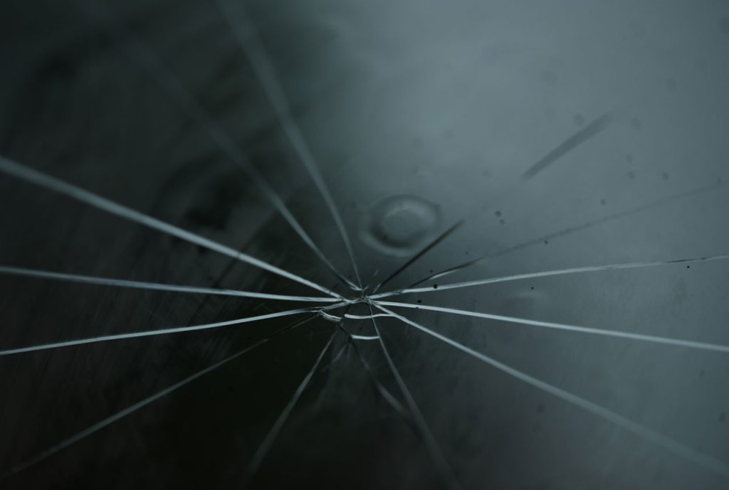 Professional assessment and repair of a severe spider crack at our certified windshield repair shop in Baltimore.