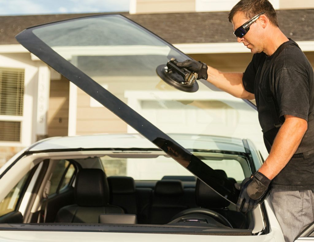 Mobile windshield replacement service provided by a top-rated auto glass company Baltimore at a customer home.