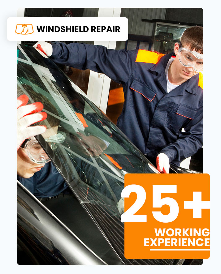 Auto glass repair team replacing a windshield