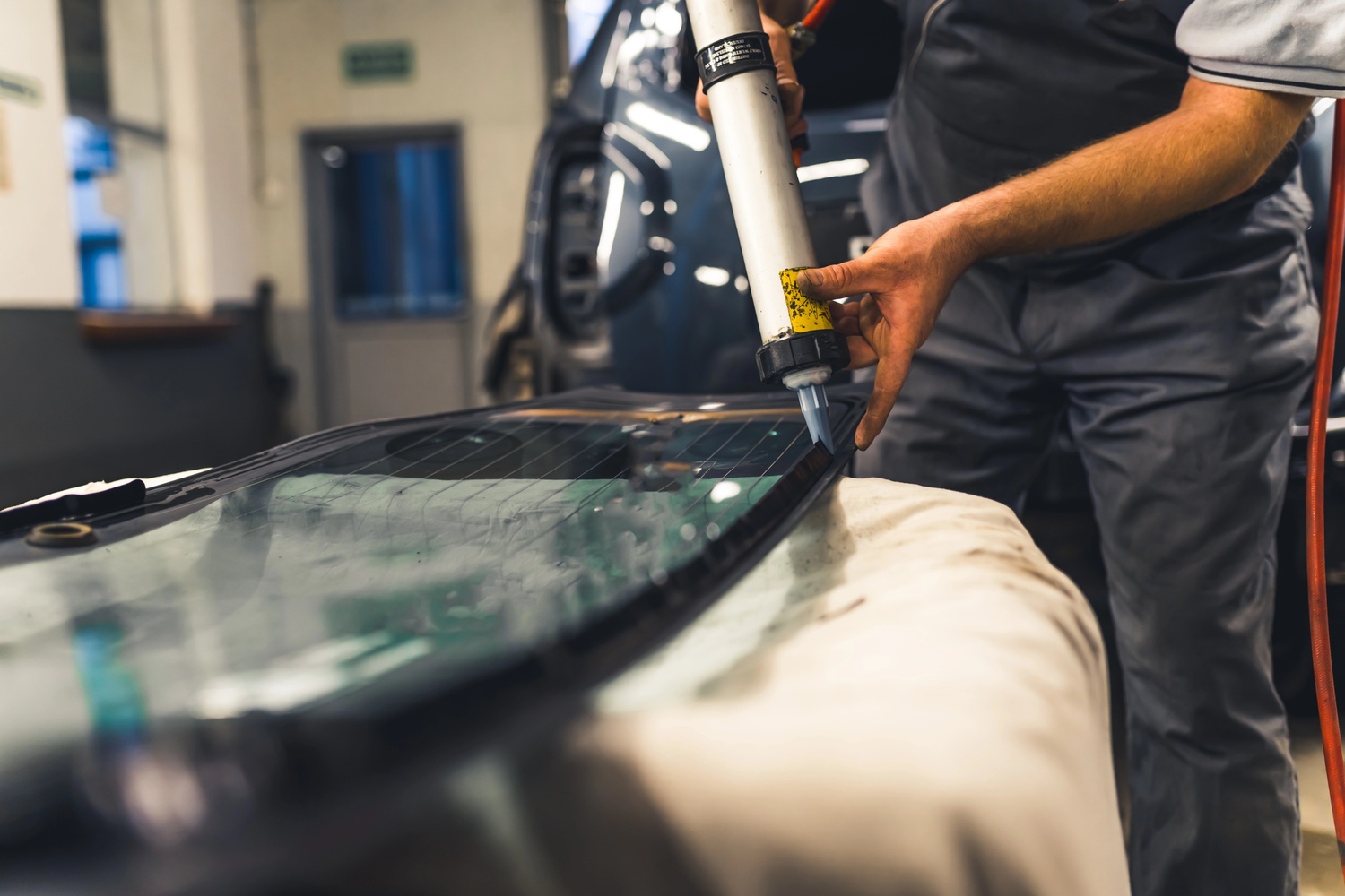 Auto glass replacement Baltimore experts repairing rear and passenger windows with precision tools to restore safety and visibility