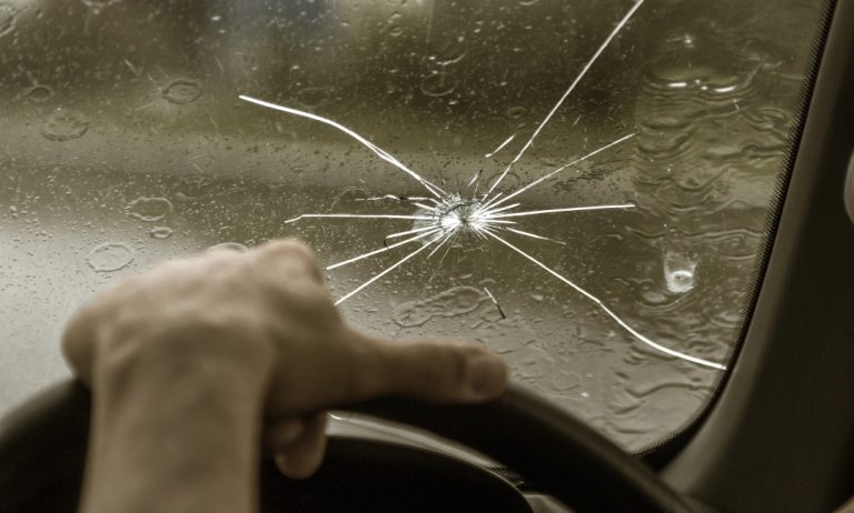 Close up of starburst glass damage from driver's seat for mobile windshield repair Baltimore emergency services.