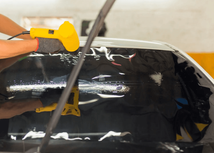 Professional heat gun application for passenger windows repair Baltimore services to fix bubbling window tint.