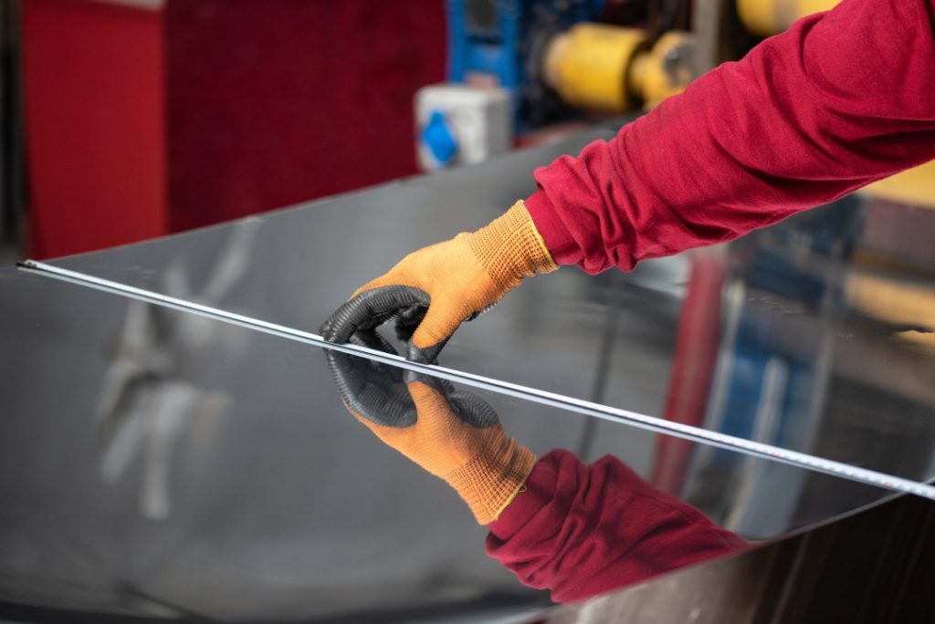 Expert measuring glass for a custom windshield repair Baltimore to ensure a perfect fit for a vehicle replacement.