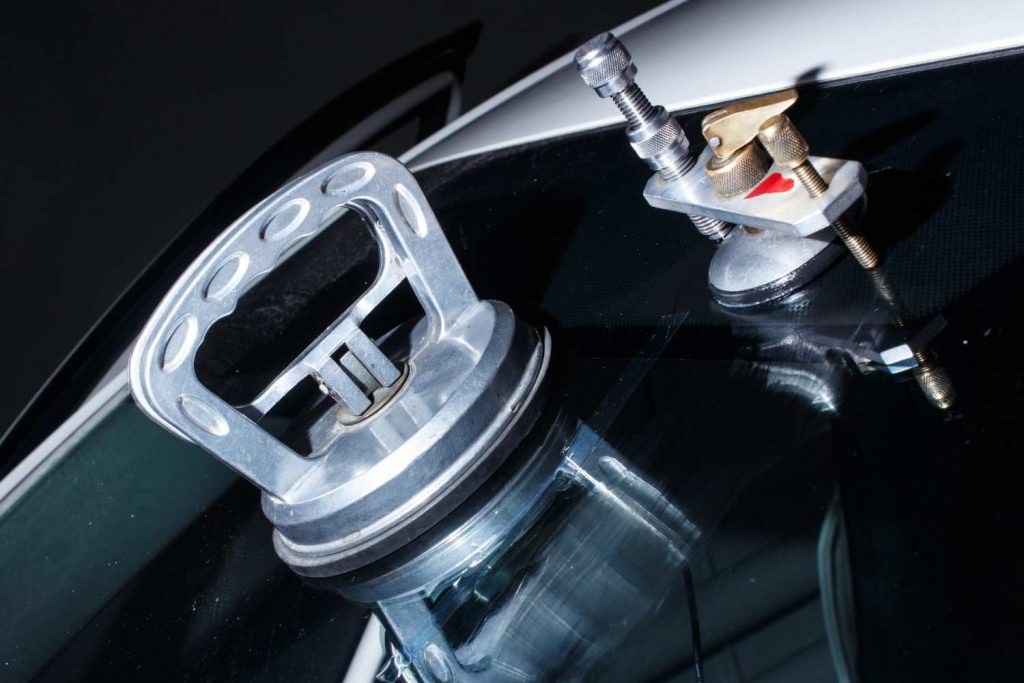 Heavy duty suction cups used by automotive glass shops Baltimore for precise windshield repair and installation. 