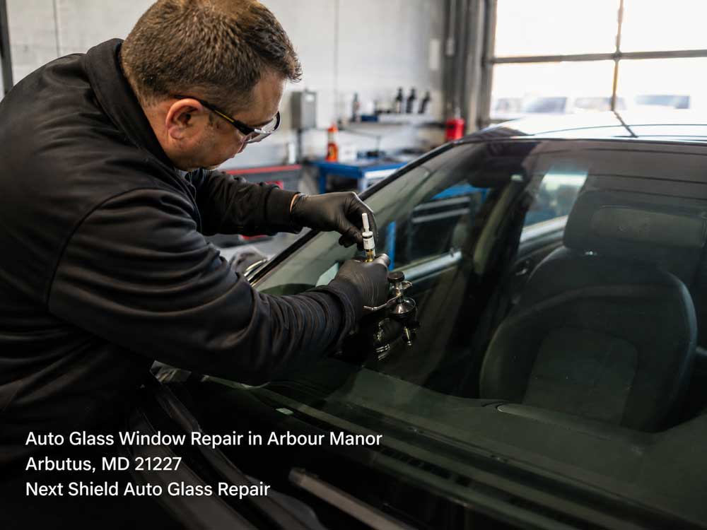 Professional technician fixing a cracked windshield using an auto glass window repair Baltimore service tool